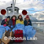 boat in winter with guests in blankets