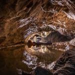 Reflections in one of the several ponds in the Beatus caves