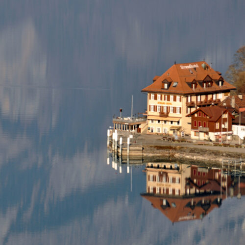 Iseltwald with Lake Brienz mirroring the mountains behind