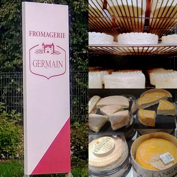 Fromagerie Germain Schild und unterschiedliche Käsesorten in Regal
