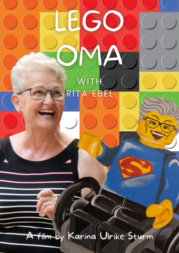 Movie poster with Lego bricks in the background. In the foreground is Rita, a woman with grey hair and glasses who is laughing. Next to her is an illustration of a Lego figure wearing a superhero outfit in a wheelchair that looks like Rita.