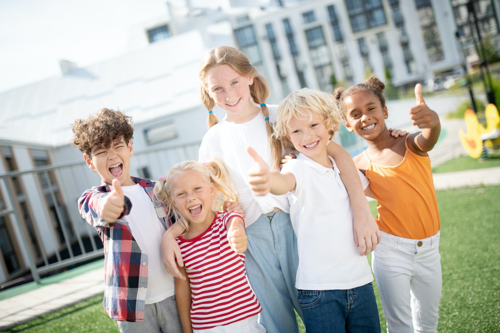 Cheerful children feeling truly happy after amazing day at school