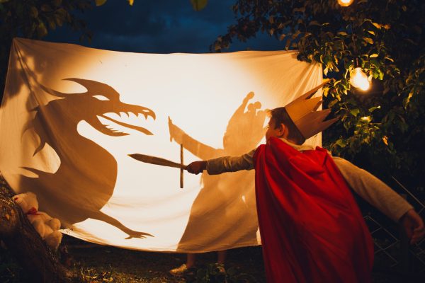 Kids fight dragon shadow, childhood tale