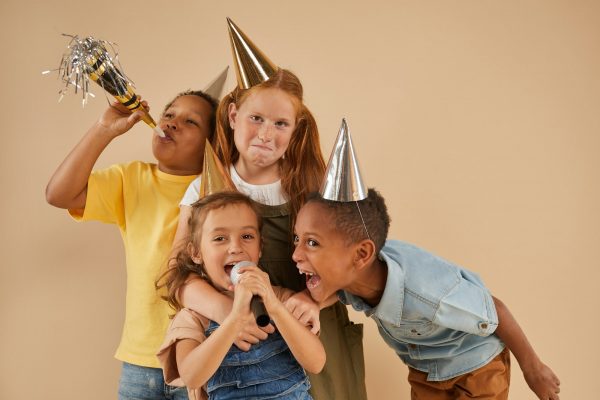 Children Playing with Microphone at Party