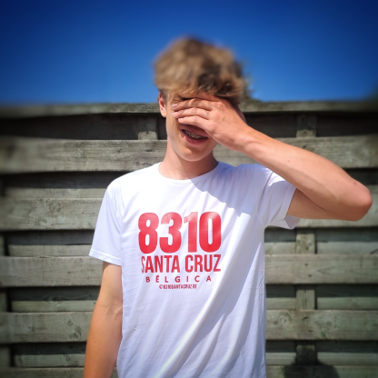 Model covering his face and wearing a white T-shirt with following print: 8310 SANTA CRUZ BELGICA