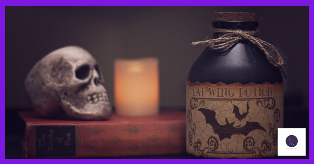 Hallowe'en skull, book and bottle.