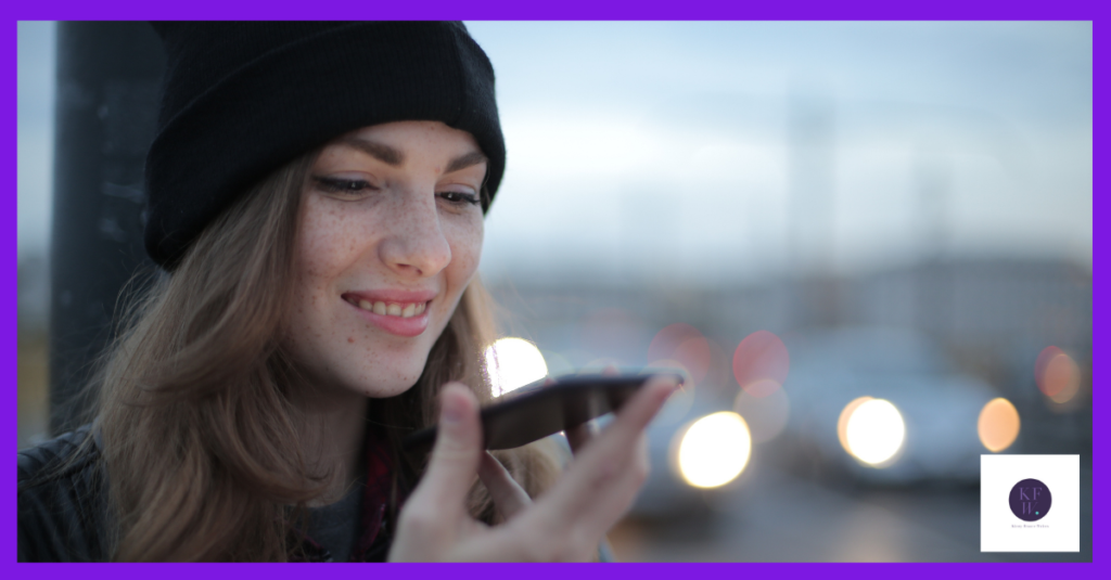 Woman smiling at phone. Sharing values in marketing.