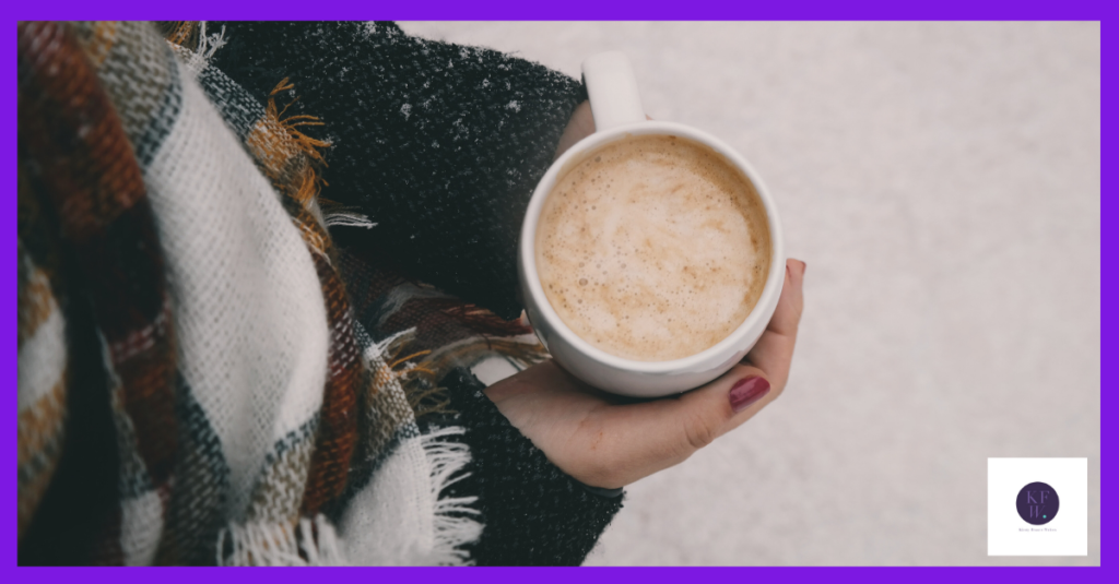 A woman with hot chocolate getting ready to plan her Christmas marketing