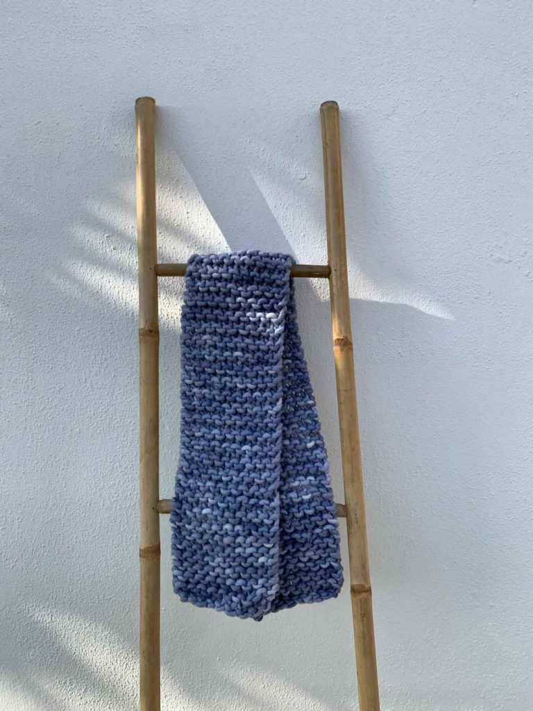 A knitted scarf in indigo color dyed by borntodye kit