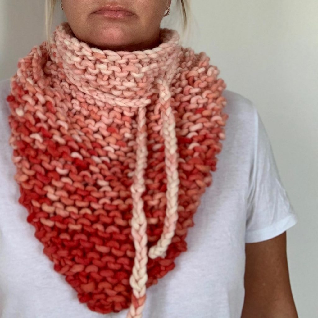 A triangle scarf in peach color dyed with the borntodye kit