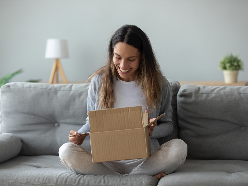 Woman opening a knitting kit