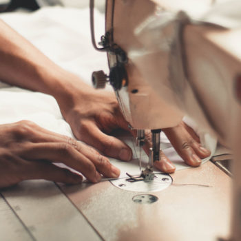 person-holding-sewing-machine-2973392