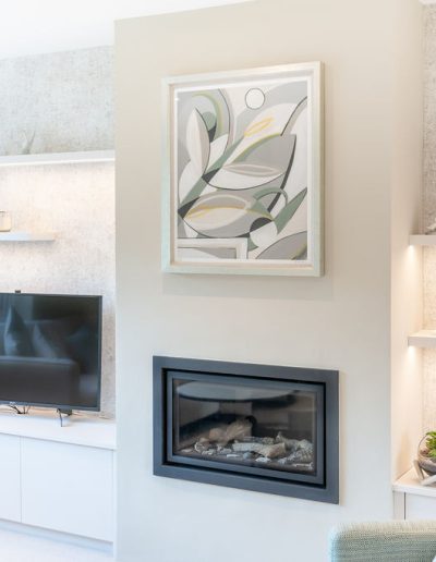 Living room renovation with art and bespoke fireplace