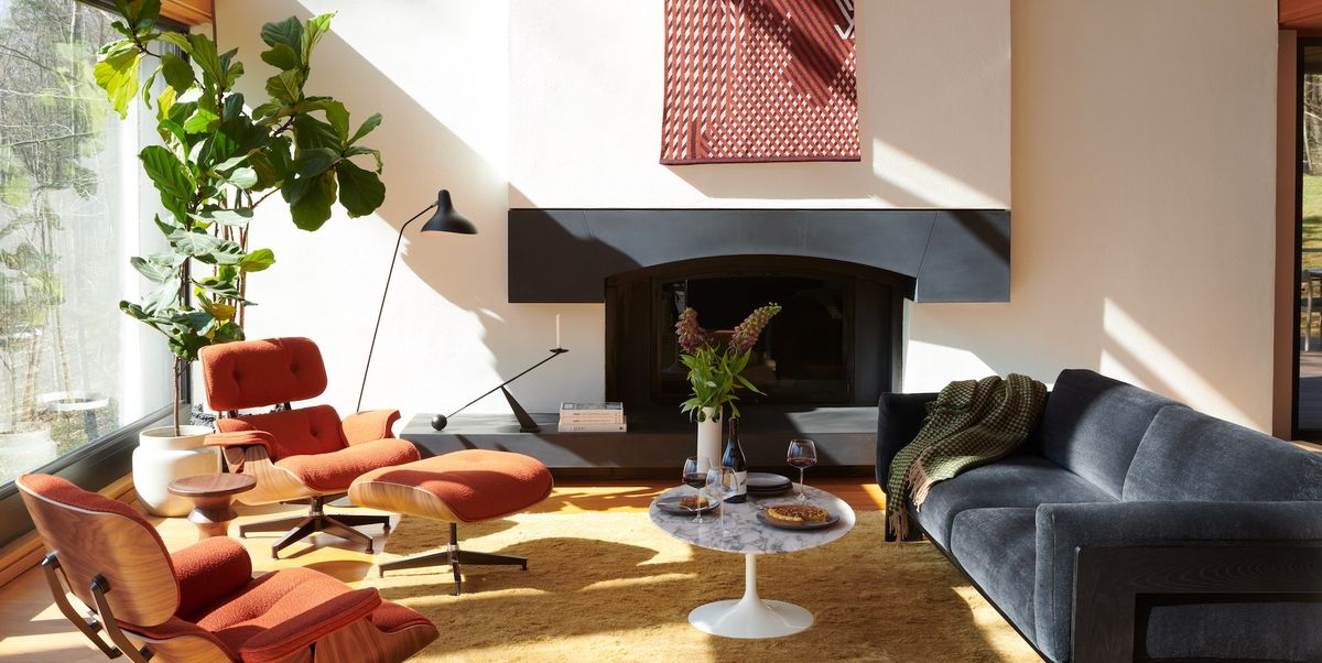 Source: House Beautiful - mid scentury living room with fireplace and eames chairs