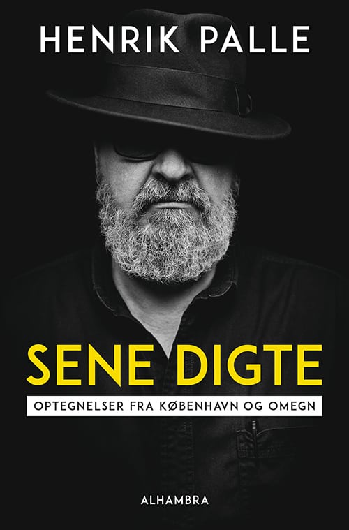 Henrik Palle med hat og ”Sene digte”.