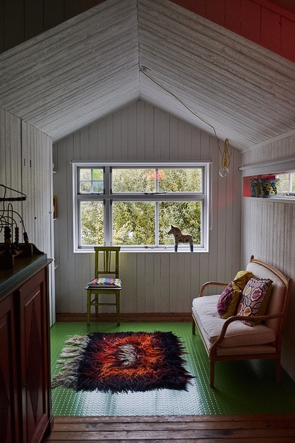 part of east room toward the east with sofa and window
