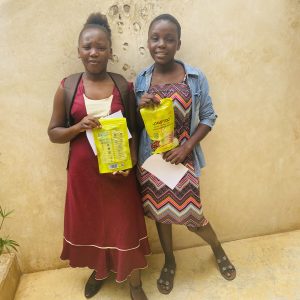 Two girls from lamu holding Padmad Sanitary Pads