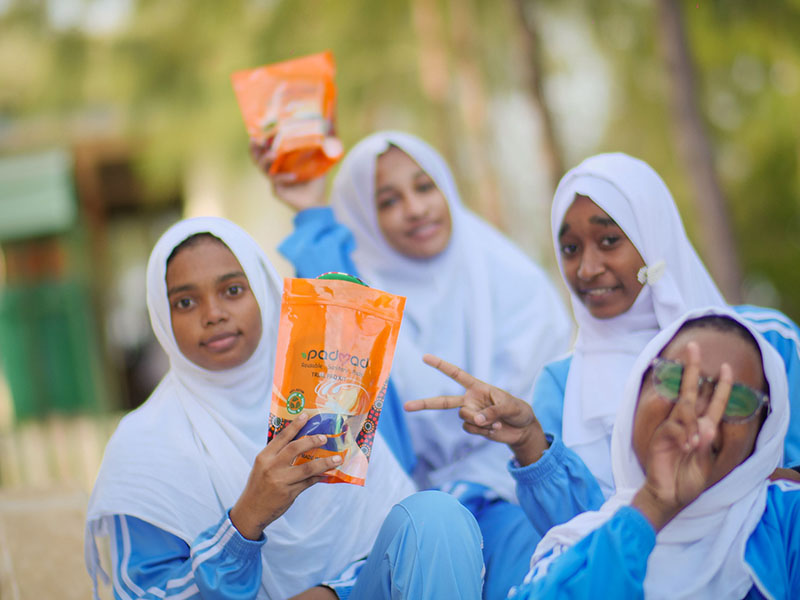 Lamu girls holding Padmad sanitary Pads