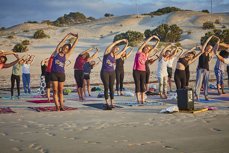 Participants having a yoga session in a retreat