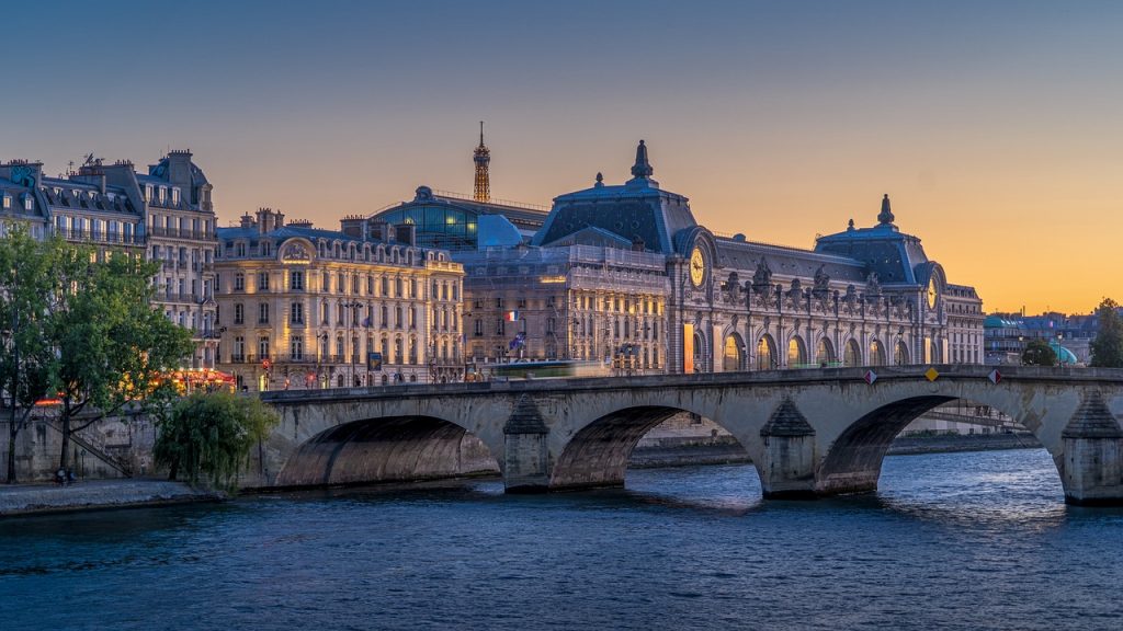 famous parisian bridge with big paris architecture