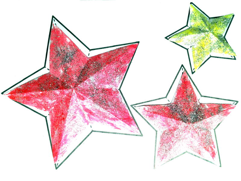 Manualidades con niños - purpurina por toda la casa - En la imagen, unas estrellas de papel con purpurina.
