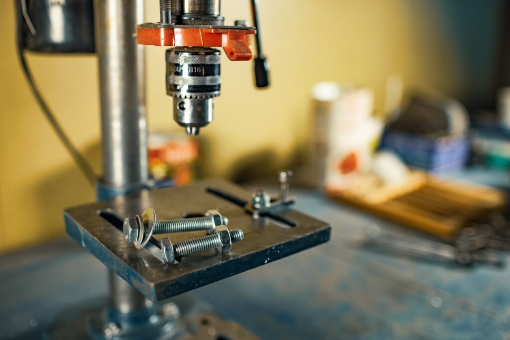 Drilling machine at the workplace in workshop