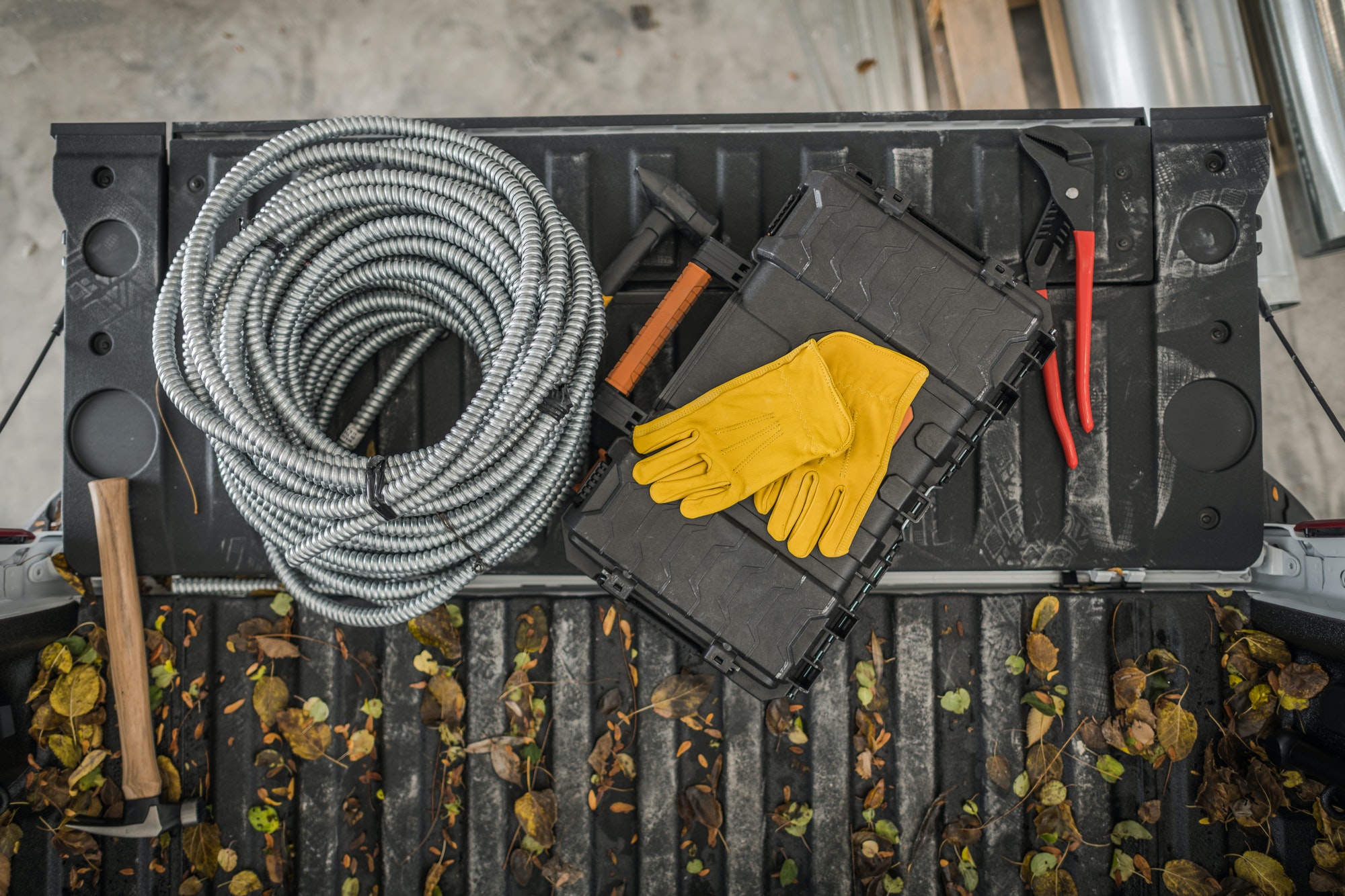 Electrician Tools and Materials on a Pickup Truck Bed Top View