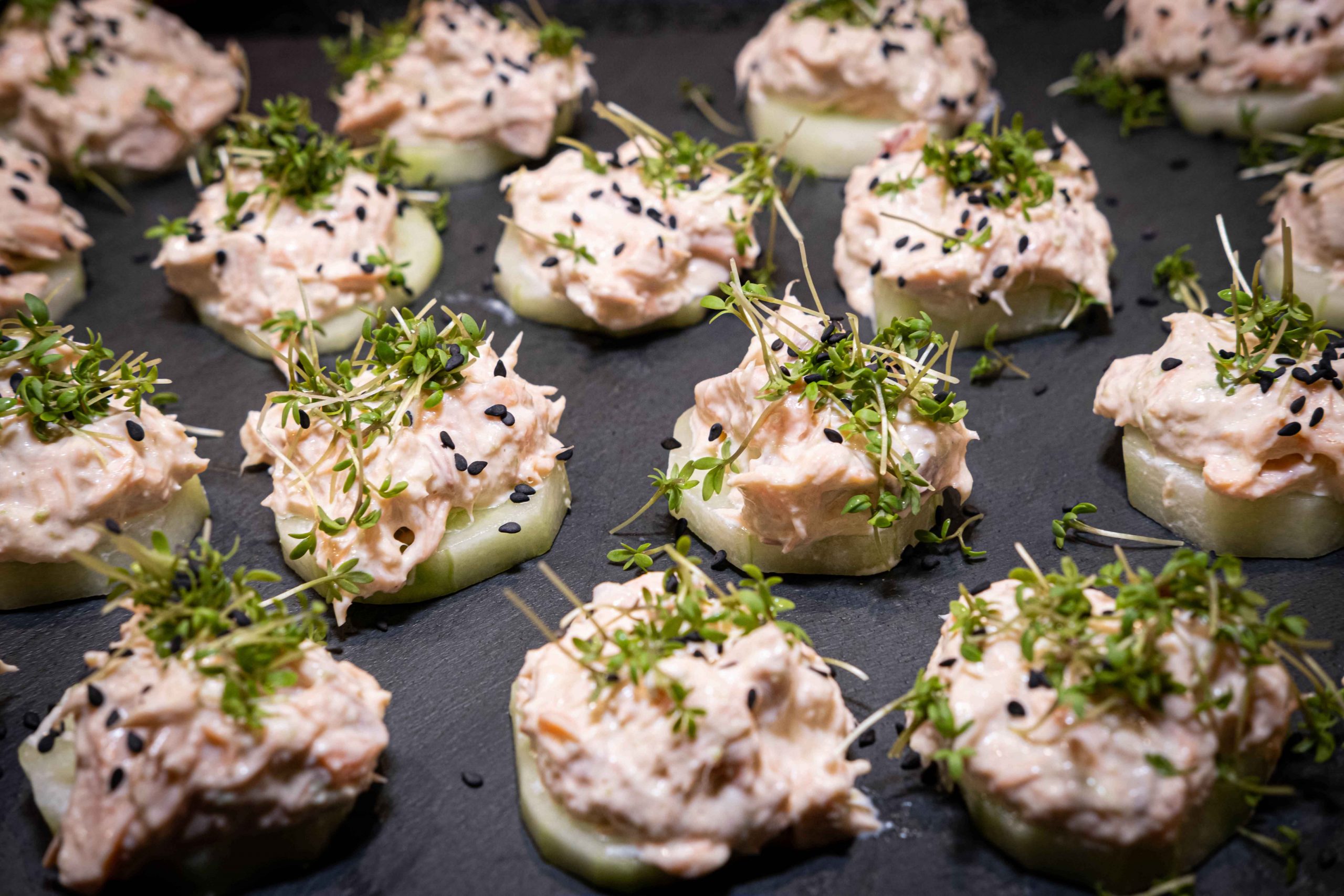 Smoked salmon on cucumber slices