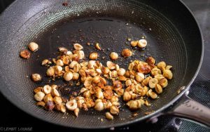 Oil and lemon marinated cabbage with roasted hazelnuts