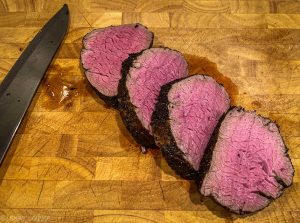 Beef tenderloin with mixed vegetables in a pan