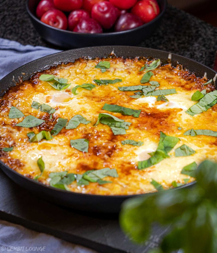 Shakshuka with minced beef egg bacon aromatic cheese