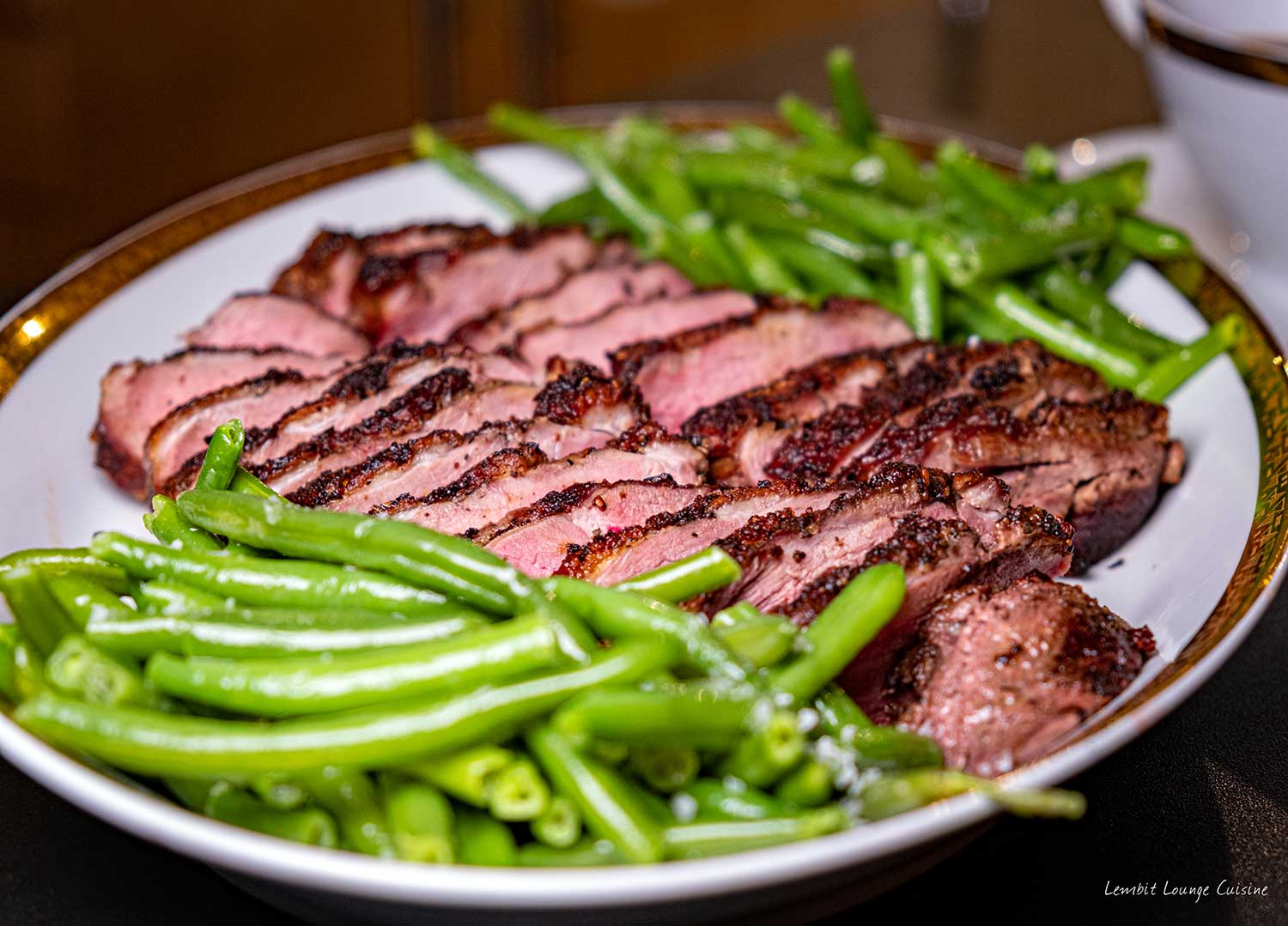 Duck breasts with orange-rum sauce haricot verts crispy