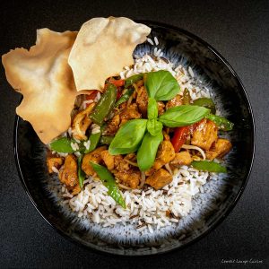 Flavorful Chicken and Basil Stir-Fry served over rice