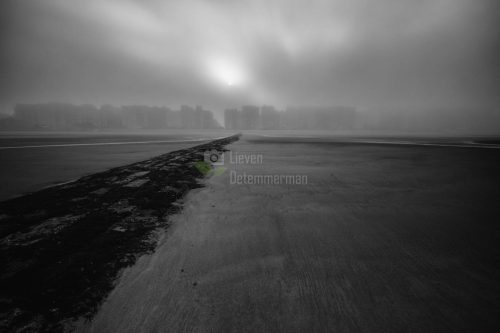 Monochrome impression of the beach on a cold foggy november day at Middelkerke, Flanders, Belgium