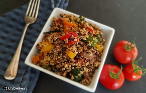 quinoa salad in a white square bowl