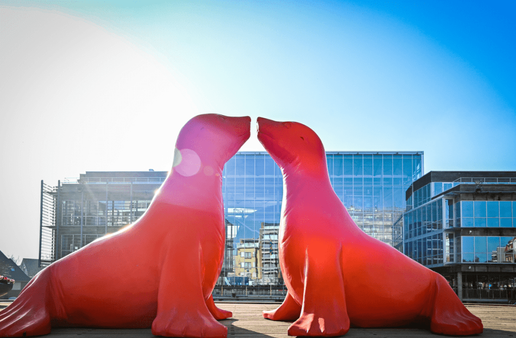 red statue of two seals