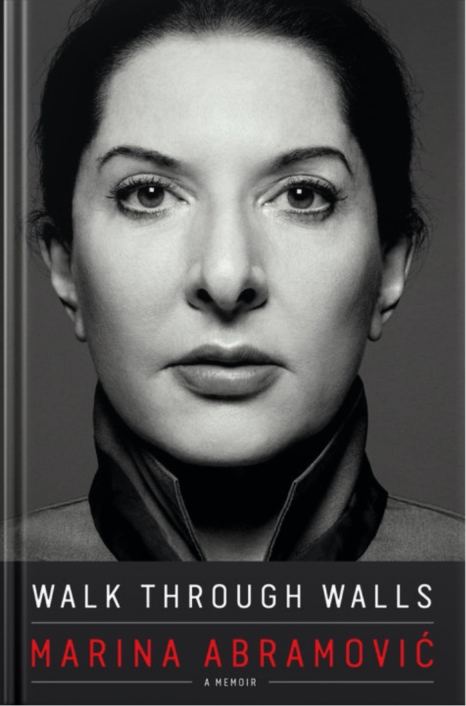 Cover of Marina Abramovic's book "Walk through walls" featuring a close up of the artist.