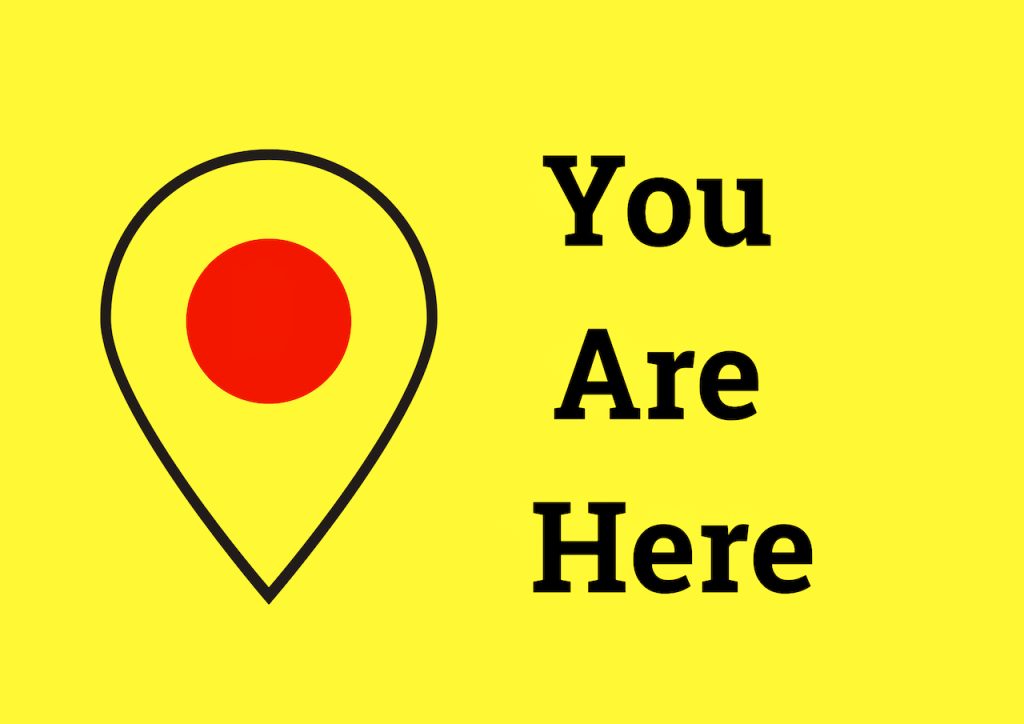 You Are Here sign on yellow background, digital art by Mihaela Limberea