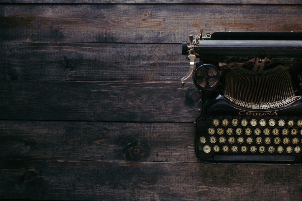 A vintage typewriter on a wooden table