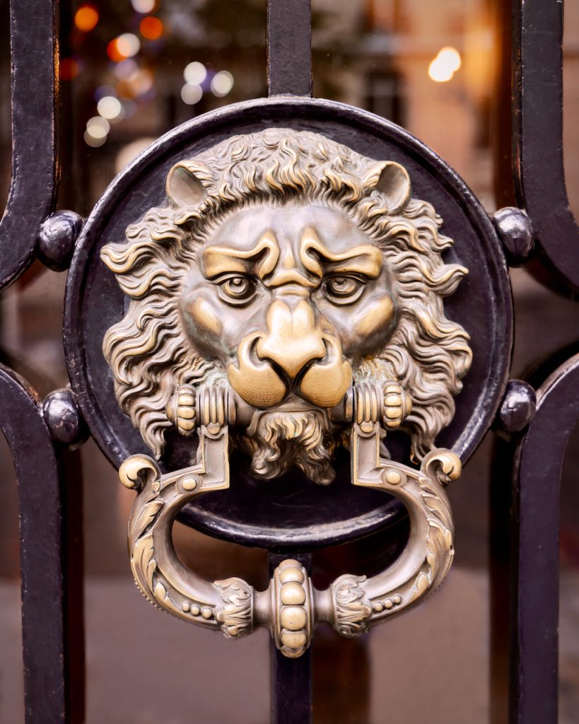 Close-up of a lion head door knocker in Paris