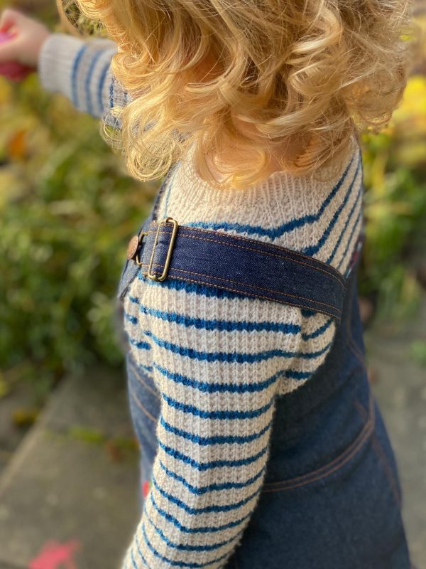 Girl in denim Spencer and striped knit