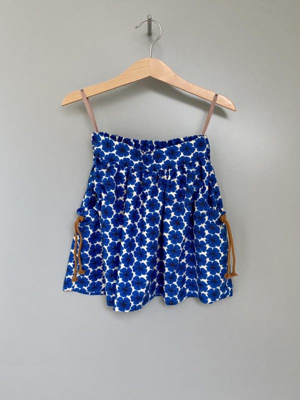 Blue printed skirt with brown strings at the side pockets