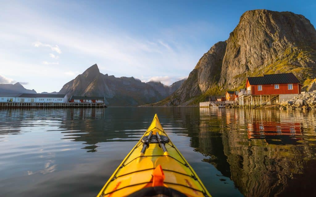 Reinefjorden Evening Kayak Tour — Sunset Fjord Paddle Paddle into golden fjord light with an exclusive evening kayak experience in Reinefjorden
