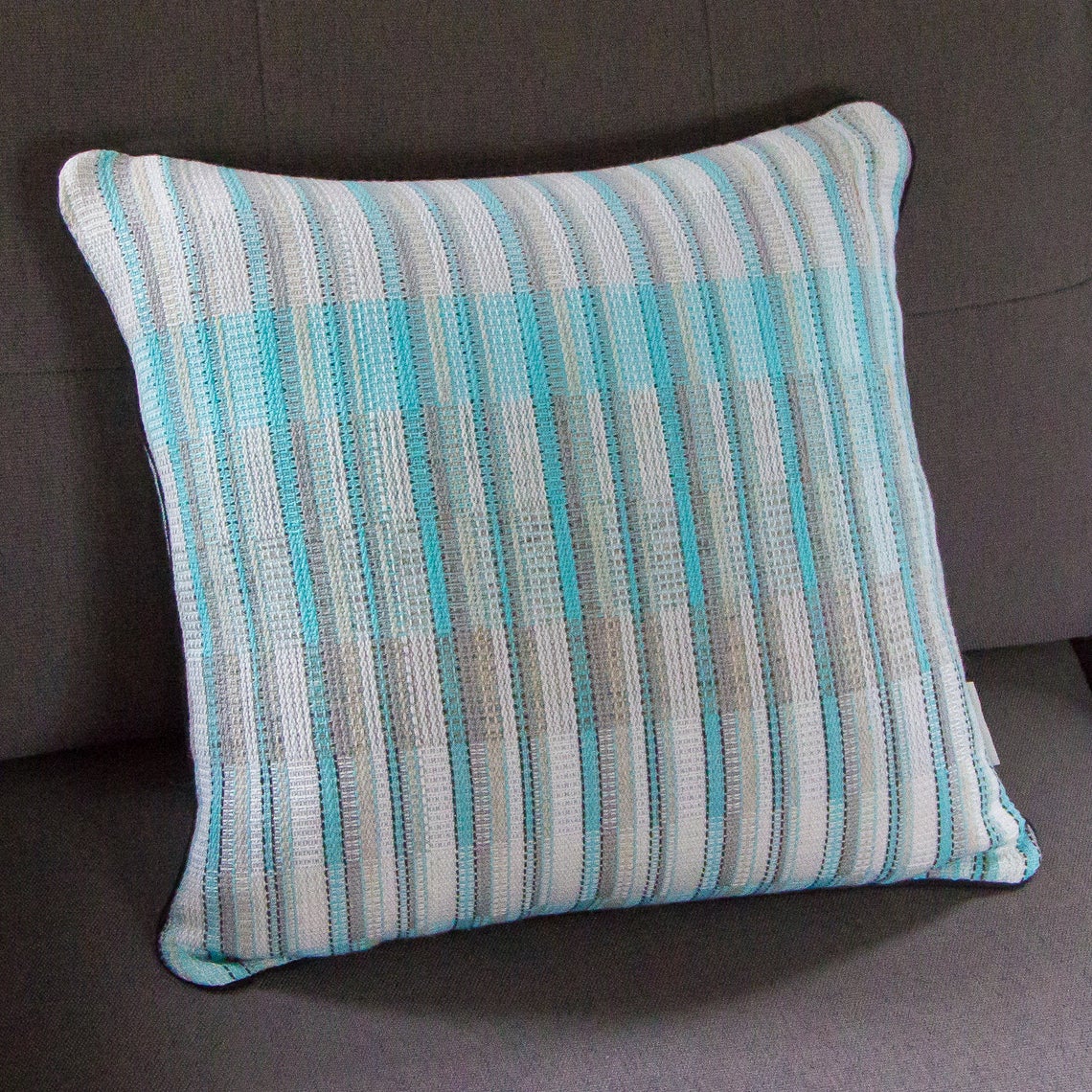 Blue white and silver striped cushion