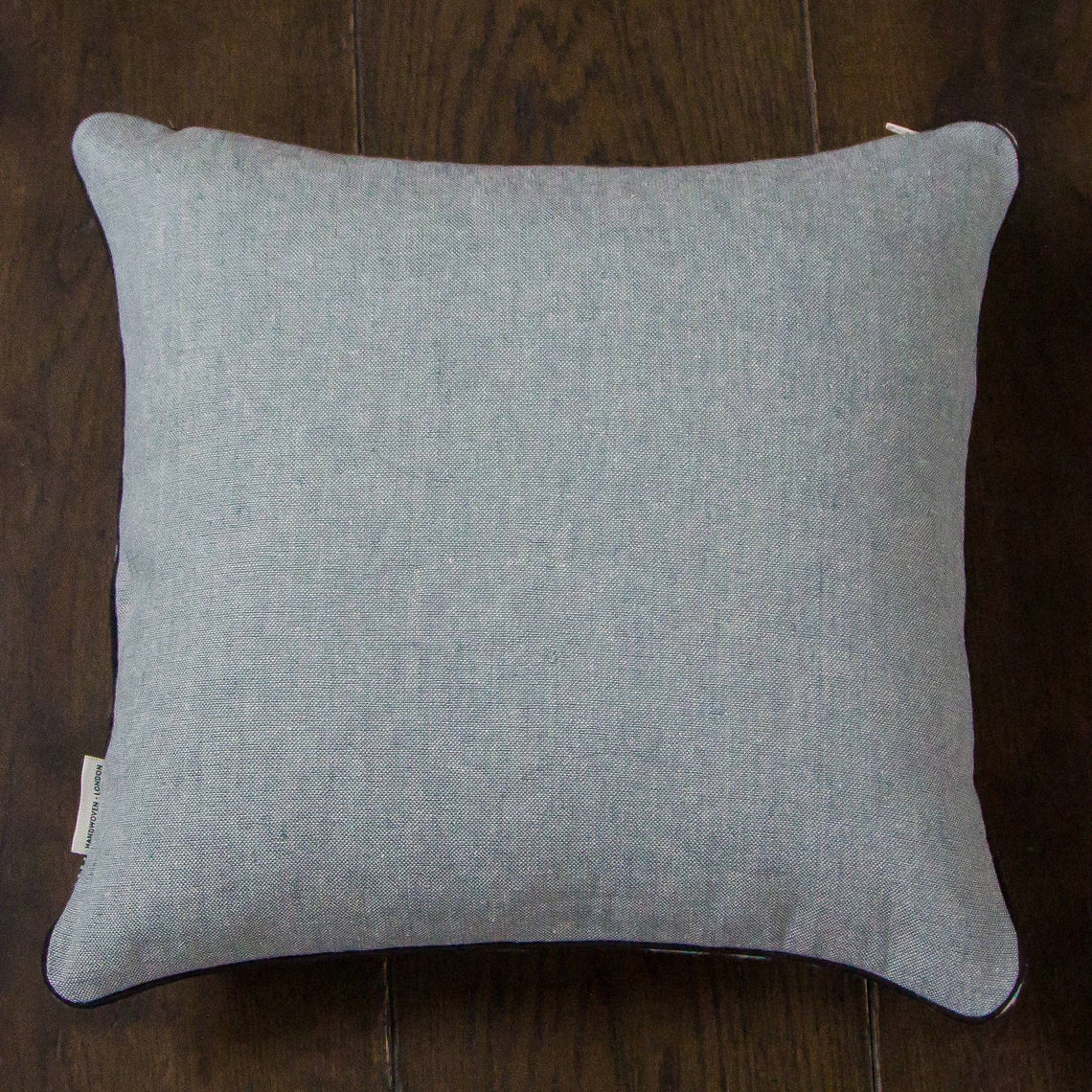 Blue white and silver striped cushion