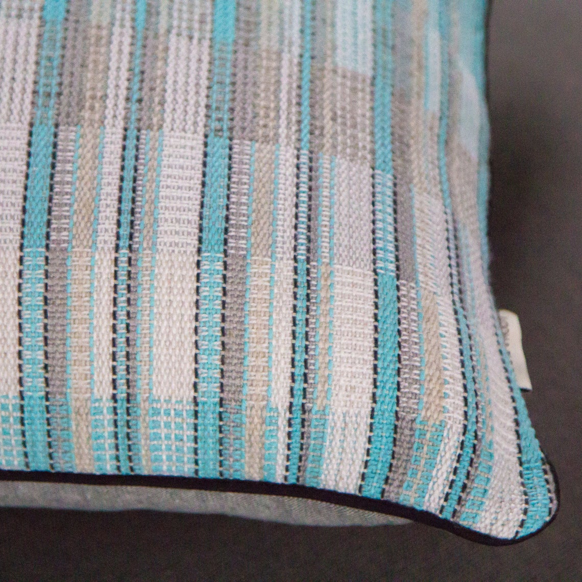 Blue white and silver striped cushion