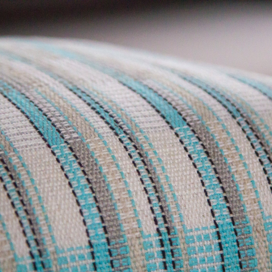 Blue white and silver striped cushion