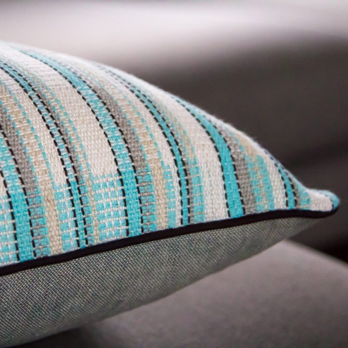 Blue white and silver striped cushion