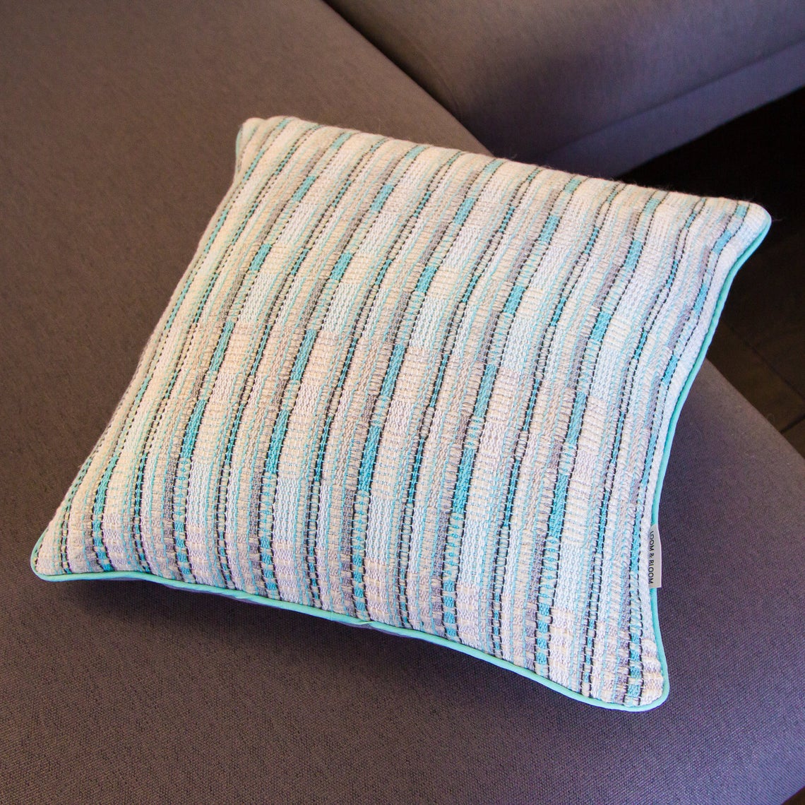Aquamarine white and silver fleck handwoven cushion