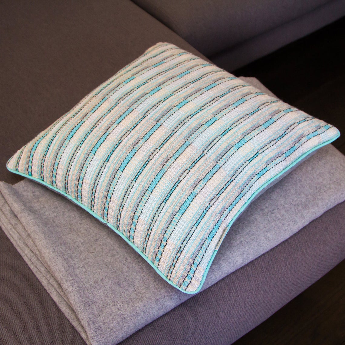 Aquamarine white and silver fleck handwoven cushion